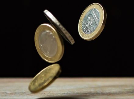 Coins on Brown Wood